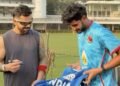 Virat Kohli Signs Autograph on Net Bowler’s India Jersey